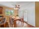 Dining area with neutral walls and a ceiling fan overlooking a table setting at 10091 Bannister St, Spring Hill, FL 34608