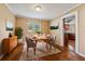 Inviting dining room with hardwood floors, neutral paint, window views, and a stylish table set at 10091 Bannister St, Spring Hill, FL 34608