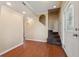 Spacious foyer showcasing wood floors, a stairway, and natural light at 10091 Bannister St, Spring Hill, FL 34608