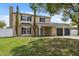 Charming two-story home with a two-car garage, a well-manicured lawn, and mature trees in a desirable neighborhood at 10091 Bannister St, Spring Hill, FL 34608