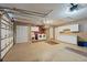 Spacious garage with washer, dryer, sink, and storage cabinets, offering ample space for parking and projects at 10091 Bannister St, Spring Hill, FL 34608