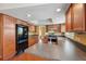Bright kitchen with stainless steel appliances and dark wood cabinetry at 10091 Bannister St, Spring Hill, FL 34608