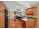 Spacious kitchen featuring stainless steel appliances and dark wood cabinetry at 10091 Bannister St, Spring Hill, FL 34608