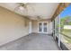 This simple covered patio offers the perfect place to unwind and enjoy the outdoors at 10091 Bannister St, Spring Hill, FL 34608