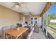 The spacious screened-in patio offers a relaxing outdoor living space with comfortable seating and ceiling fans at 10091 Bannister St, Spring Hill, FL 34608