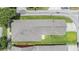 Aerial view of the home's roof and surrounding green lawn at 10115 Ringling St, New Port Richey, FL 34655
