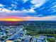 Picturesque aerial view of community with colorful sunset at 10115 Ringling St, New Port Richey, FL 34655