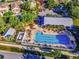 Aerial view of the community pool, featuring ample lounge chairs, shade umbrellas, and a Gathering-friendly design at 10115 Ringling St, New Port Richey, FL 34655