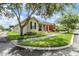 Well-kept home with a charming front porch and manicured landscaping at 10115 Ringling St, New Port Richey, FL 34655