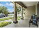 Spacious front porch with stylish seating, perfect for relaxing and enjoying the neighborhood views at 10115 Ringling St, New Port Richey, FL 34655