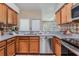 Well-appointed kitchen with stainless steel appliances, granite countertops, ample storage at 10115 Ringling St, New Port Richey, FL 34655