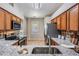 Bright kitchen with stainless steel appliances, granite counters, tile floors, and an eat-in area at 10115 Ringling St, New Port Richey, FL 34655