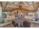Covered outdoor seating area with wooden benches and tables for relaxing at 10115 Ringling St, New Port Richey, FL 34655