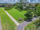 Aerial view of Owney Park with walking paths, lush lawns, and community green space at 10115 Ringling St, New Port Richey, FL 34655