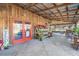 Covered patio area displaying a variety of plants for sale near the entrance at 10115 Ringling St, New Port Richey, FL 34655