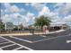 Front view of Longleaf Elementary with a gated entrance, parking, and a modern building design at 10115 Ringling St, New Port Richey, FL 34655