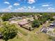 Community aerial view with mature trees, well-kept lawns, and neighborhood streets at 10124 Heathcliff St, Spring Hill, FL 34608
