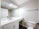 Bright bathroom featuring a large mirror, white vanity and fixtures at 10124 Heathcliff St, Spring Hill, FL 34608