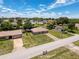 Charming single-story home with a detached garage and a well-maintained lawn at 10124 Heathcliff St, Spring Hill, FL 34608