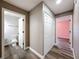 Hallway with wood-look flooring leading to the bathroom, bedroom and closet at 10124 Heathcliff St, Spring Hill, FL 34608