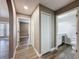 Hallway with wood-look flooring leading to the bathroom, bedroom and closet at 10124 Heathcliff St, Spring Hill, FL 34608