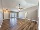 Spacious open living room with vaulted ceilings, arched doorway, and wood-look floors at 10124 Heathcliff St, Spring Hill, FL 34608