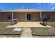 Back patio featuring a sliding glass door, table, chairs, and grill at 10124 Heathcliff St, Spring Hill, FL 34608