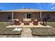 Back patio featuring a sliding glass door, grill, and outdoor seating area at 10124 Heathcliff St, Spring Hill, FL 34608