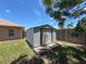 View of the outdoor storage shed in the backyard, next to the house at 10124 Heathcliff St, Spring Hill, FL 34608