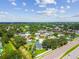An aerial shot displays neighborhood homes, showcasing the location of this property near a major road at 1071 Lexington Ct, Largo, FL 33771