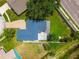 An aerial view of this home showcasing its layout, expansive backyard, and outdoor living space at 1071 Lexington Ct, Largo, FL 33771