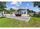 Backyard deck provides an inviting spot for al fresco dining and relaxation, with views of the lush lawn at 1071 Lexington Ct, Largo, FL 33771
