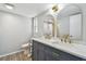Bathroom featuring double vanity with marble countertop, modern sinks, and trendy fixtures at 1071 Lexington Ct, Largo, FL 33771