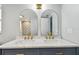 Bathroom featuring double vanity with marble countertop, modern sinks, and trendy fixtures at 1071 Lexington Ct, Largo, FL 33771