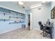 Bedroom with ample space featuring blue walls, wood-look floors, ceiling fan, and closet with shelves at 1071 Lexington Ct, Largo, FL 33771