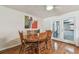 Dining area with hardwood floors, a ceiling fan, a wooden dining table with seating for six people at 1071 Lexington Ct, Largo, FL 33771