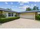 Charming home featuring a brick driveway leading to an attached two car garage at 1071 Lexington Ct, Largo, FL 33771