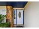 Close up of the front door of a home with stone and a decorative glass window at 1071 Lexington Ct, Largo, FL 33771