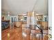 Open concept living room flowing into the kitchen with stainless steel appliances at 1071 Lexington Ct, Largo, FL 33771