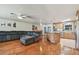 Inviting living room with a plush sectional sofa, hardwood floors, and an open layout at 1071 Lexington Ct, Largo, FL 33771
