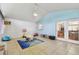 Bright sunroom featuring tile flooring, neutral walls, and large windows and doors for plenty of light at 1071 Lexington Ct, Largo, FL 33771