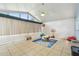 Bright sunroom featuring tile flooring, neutral walls, and large windows and doors for plenty of light at 1071 Lexington Ct, Largo, FL 33771