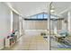 Bright sunroom featuring tile flooring, neutral walls, and large windows and doors for plenty of light at 1071 Lexington Ct, Largo, FL 33771