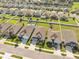 Aerial view showcasing properties with well-maintained lawns, play sets, and backyard spaces at 1098 Old Windsor Way, Spring Hill, FL 34609