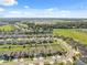 Stunning aerial view of a community highlighting the well-planned layout and green surroundings at 1098 Old Windsor Way, Spring Hill, FL 34609