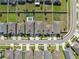 Aerial view of homes showcasing well-maintained yards, neighborhood streetscapes, and backyard pools at 1098 Old Windsor Way, Spring Hill, FL 34609