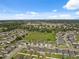 Spacious neighborhood with similar homes, grassy area and clear blue skies. A great place to live and enjoy the outdoors at 1098 Old Windsor Way, Spring Hill, FL 34609
