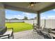 Spacious backyard featuring a well-maintained lawn and a white privacy fence at 1098 Old Windsor Way, Spring Hill, FL 34609