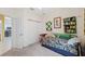 Cozy bedroom featuring a bed, a ceiling fan, and closet space at 1098 Old Windsor Way, Spring Hill, FL 34609