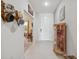 Inviting home entryway featuring tile flooring, decor, and a view into the living area at 1098 Old Windsor Way, Spring Hill, FL 34609